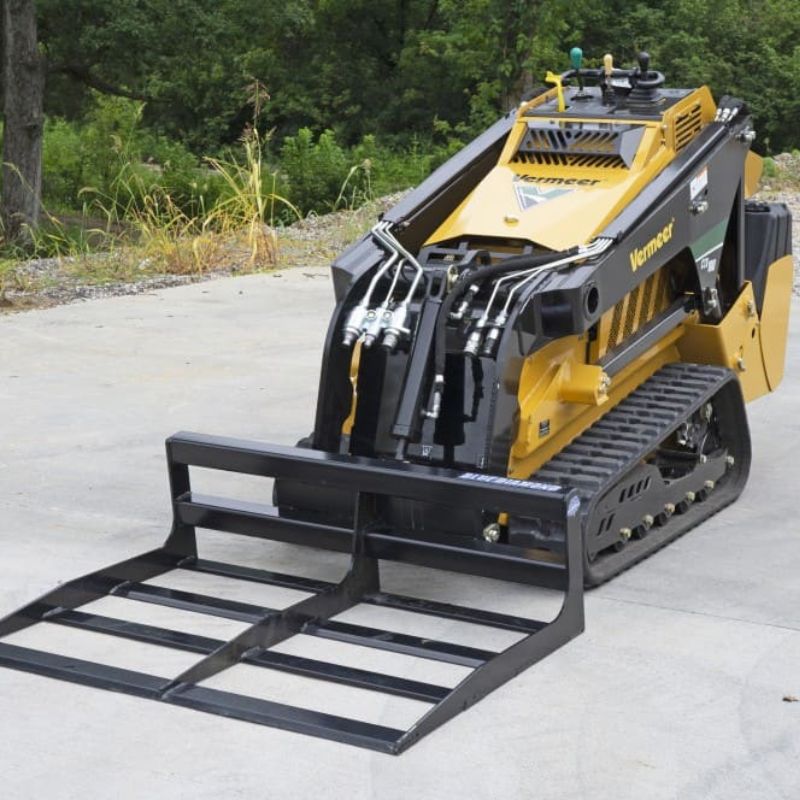 mini skid steer with blue diamond land planer