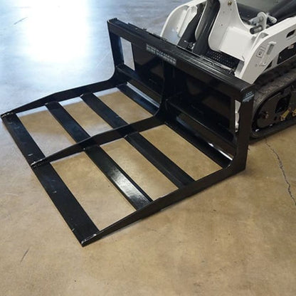 bobcat mini skid steer with blue diamond land planer attachment