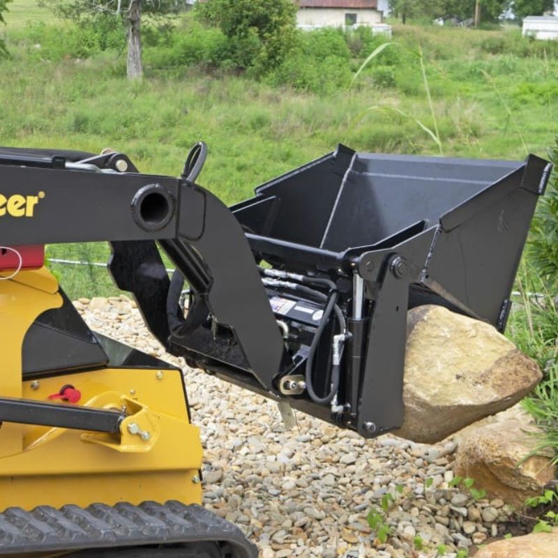vermeer mini skid steer in action with the 4 in 1 bucket attachment