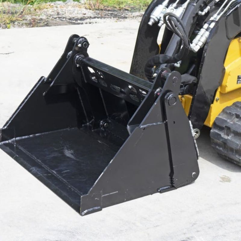 mini skid steer ready to action with the blue diamond 4 in 1 bucket attachment