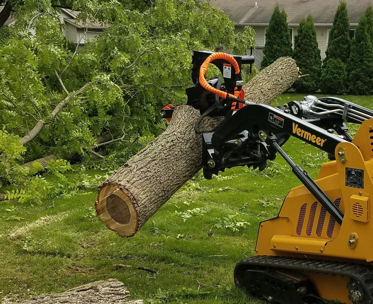Vermeer Mini Skid Steer in action with the mini forestry claw from Berlon
