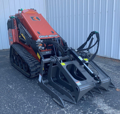 ditch witch mini skid steer with the mini root grapple attachment from berlon