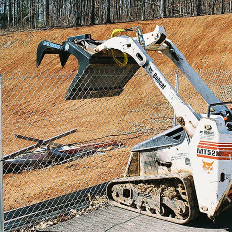 bobcat mini skid steer with the blue diamond grapple bucket attachment