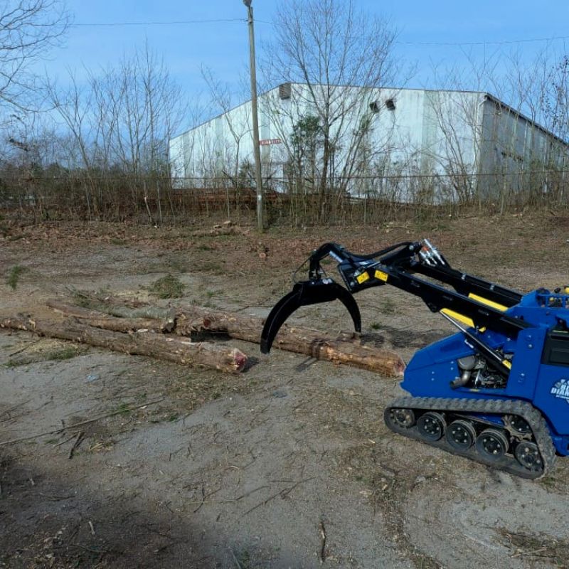 blue diamond mini log grapple attachment in action