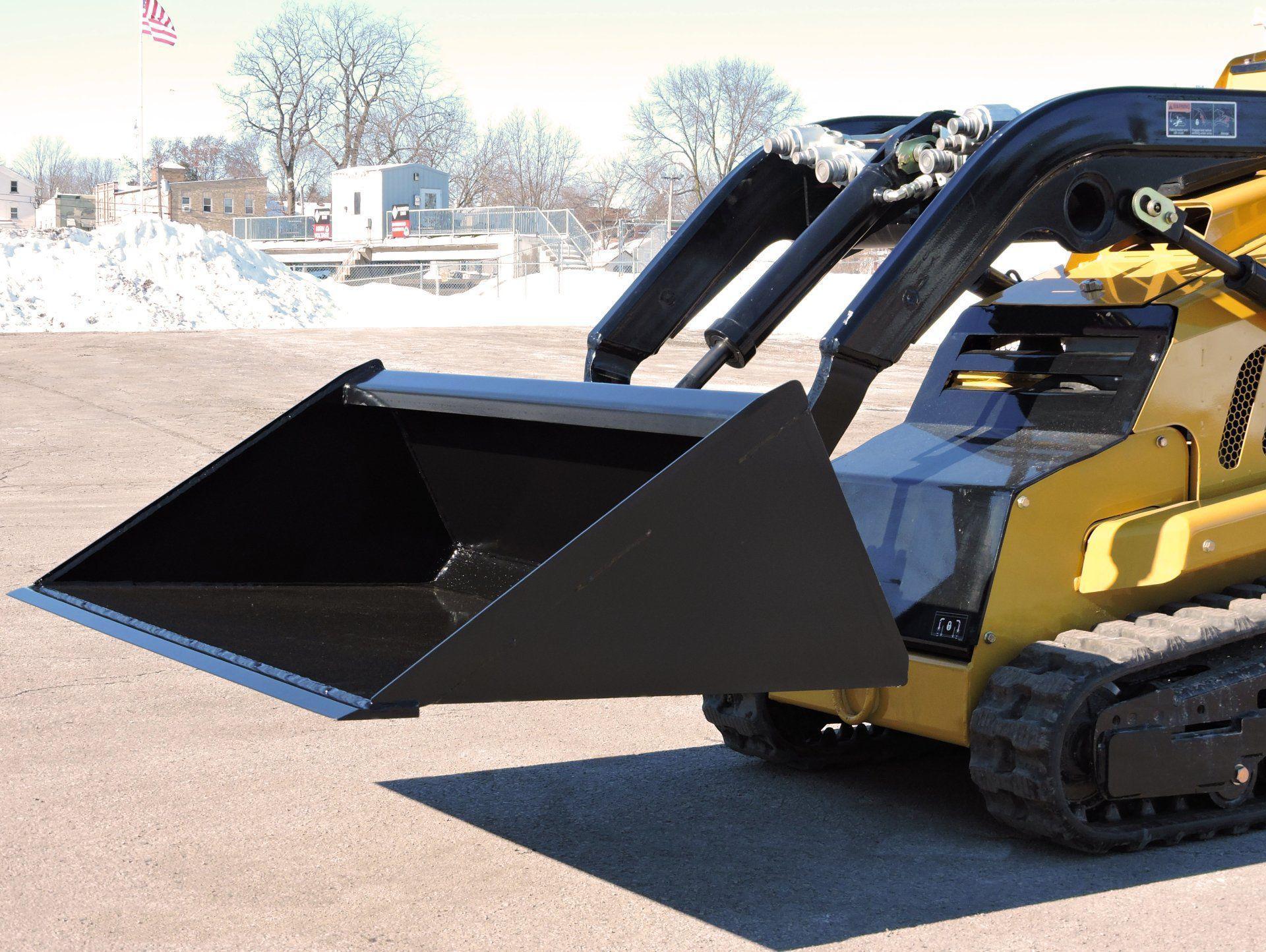 Mini Low Pro Bucket from Berlon Industries in action on a mini skid steer