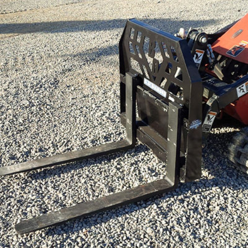 ditch witch mini skid steer in action with the blue diamond mini pallet fork