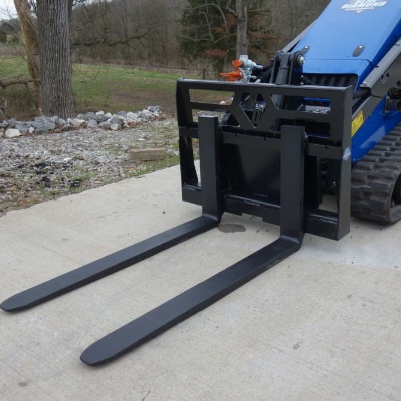 mini skid steer with the blue diamond low profile pallet forks