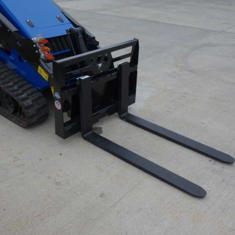 ready to action mini skid steer with blue diamond mini pallet forks