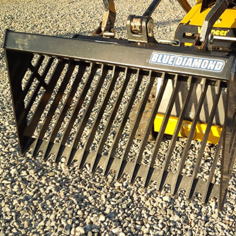 mini skid steer with the blue diamond mini rock bucket attachment