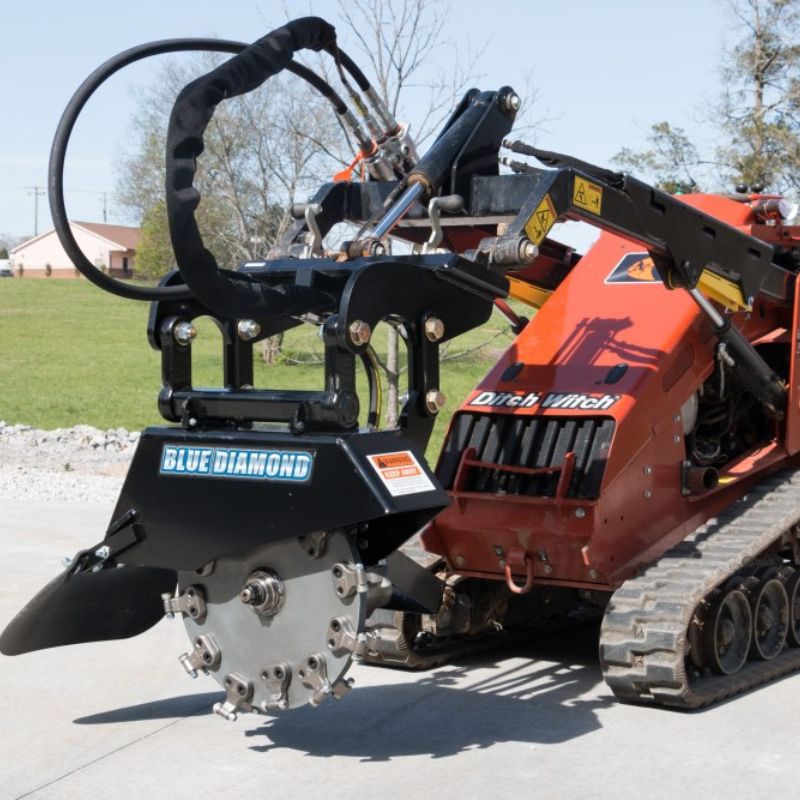 mini skid steer with the stump grinder attachment from blue diamond