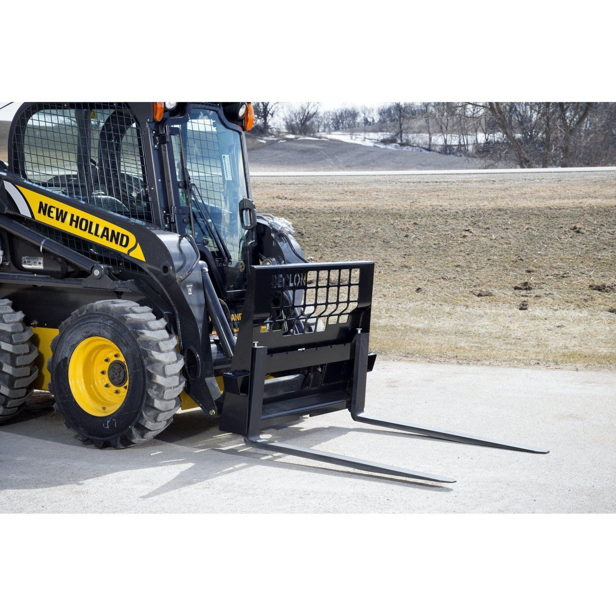 new holland skid steer in action with the heavy duty pallet forks from berlon