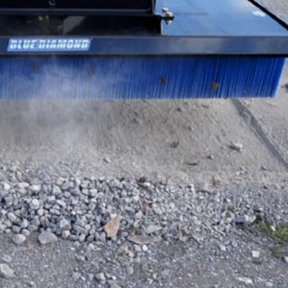 blue diamond push broom attachment in action