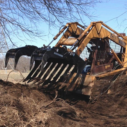 Blue Diamond Severe Duty Root Grapple being used to pull up roots