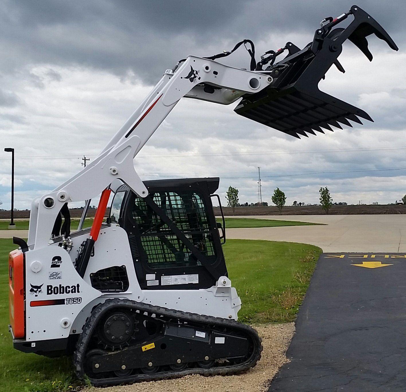 bobcat skid steer ready to grapple with the root grapple attachment from berlon industries