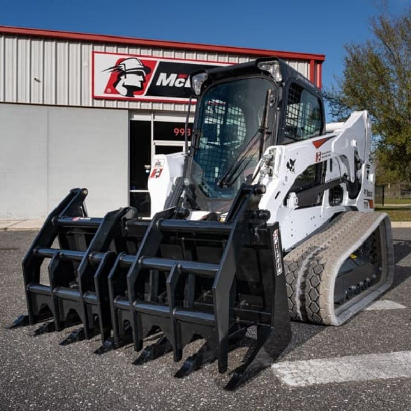 bobcat skid steer with the Vertical Root Rake Grapple attachment  from McLaren Industries