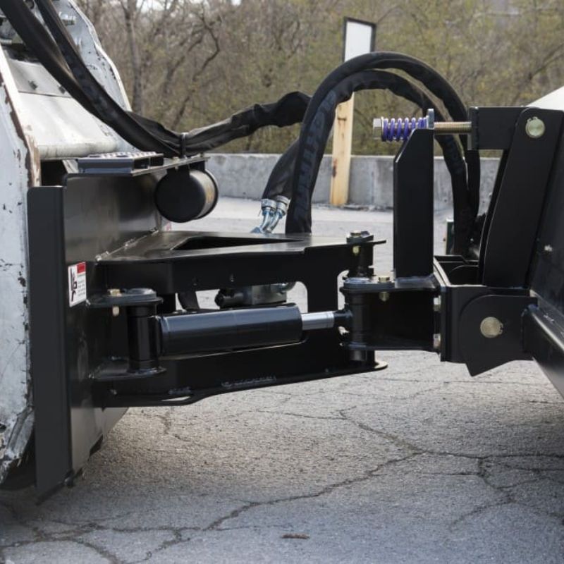 bobcat skid steer sweeper attachment in action from blue diamond