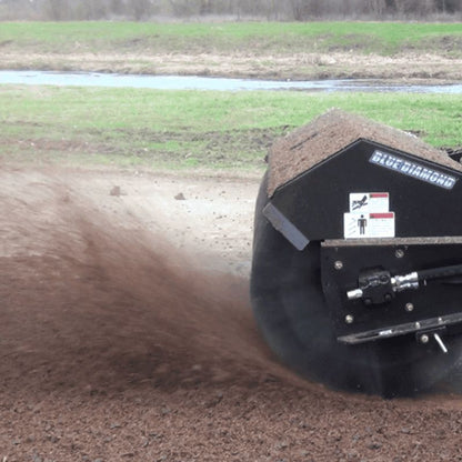 demonstrating skid steer broom attachment of blue diamond