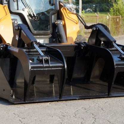 skid steer with blue diamond grapple bucket