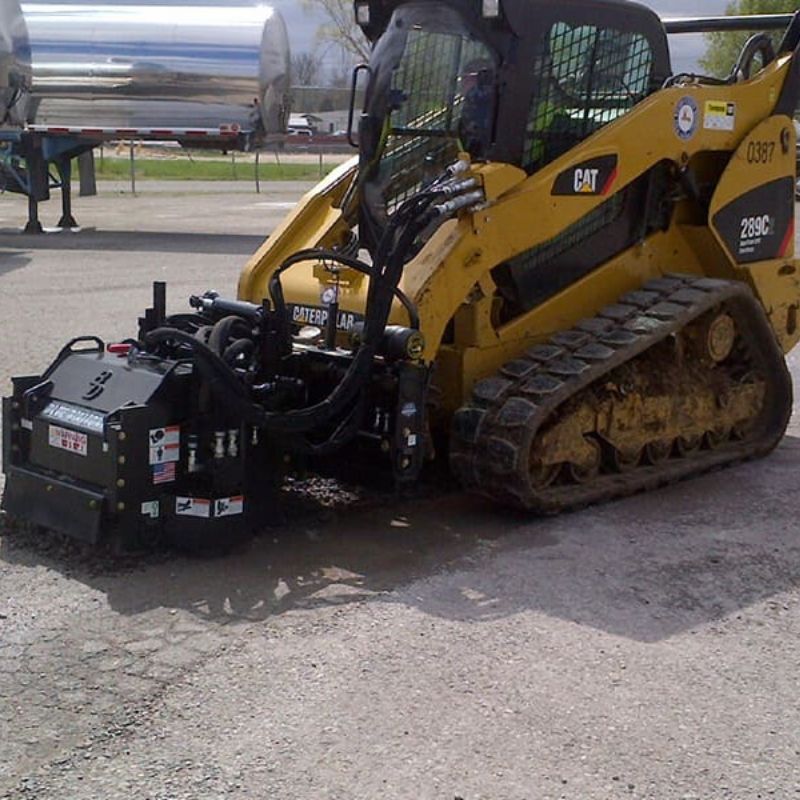 Cat skid steer with the high flow cold planer attachment from Blue Diamond