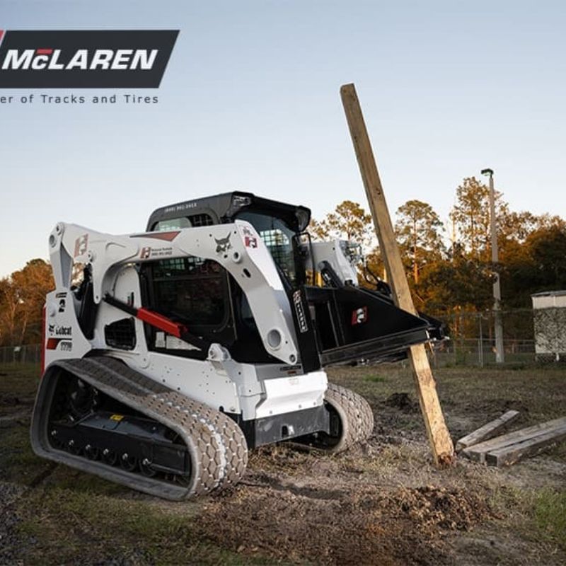 Post and Tree Puller in action on a bobcat skid steer from  McLaren Industries