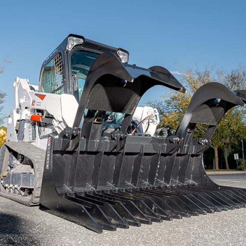 closer look of the rock rake grapple bucket attachment for skid steer from mclaren