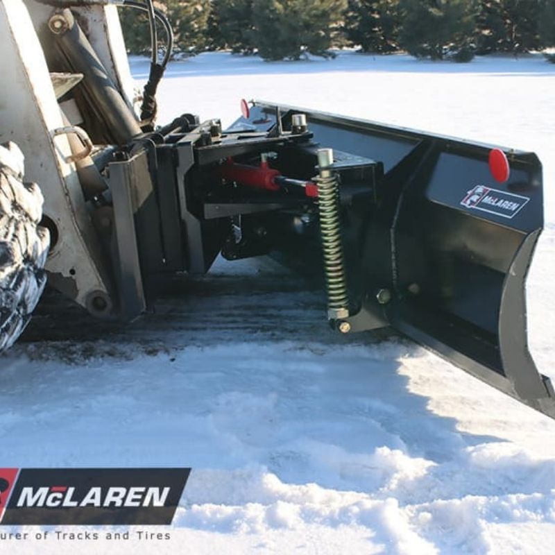 plowing snow with the mclarens snow plow blade skid steer attachment