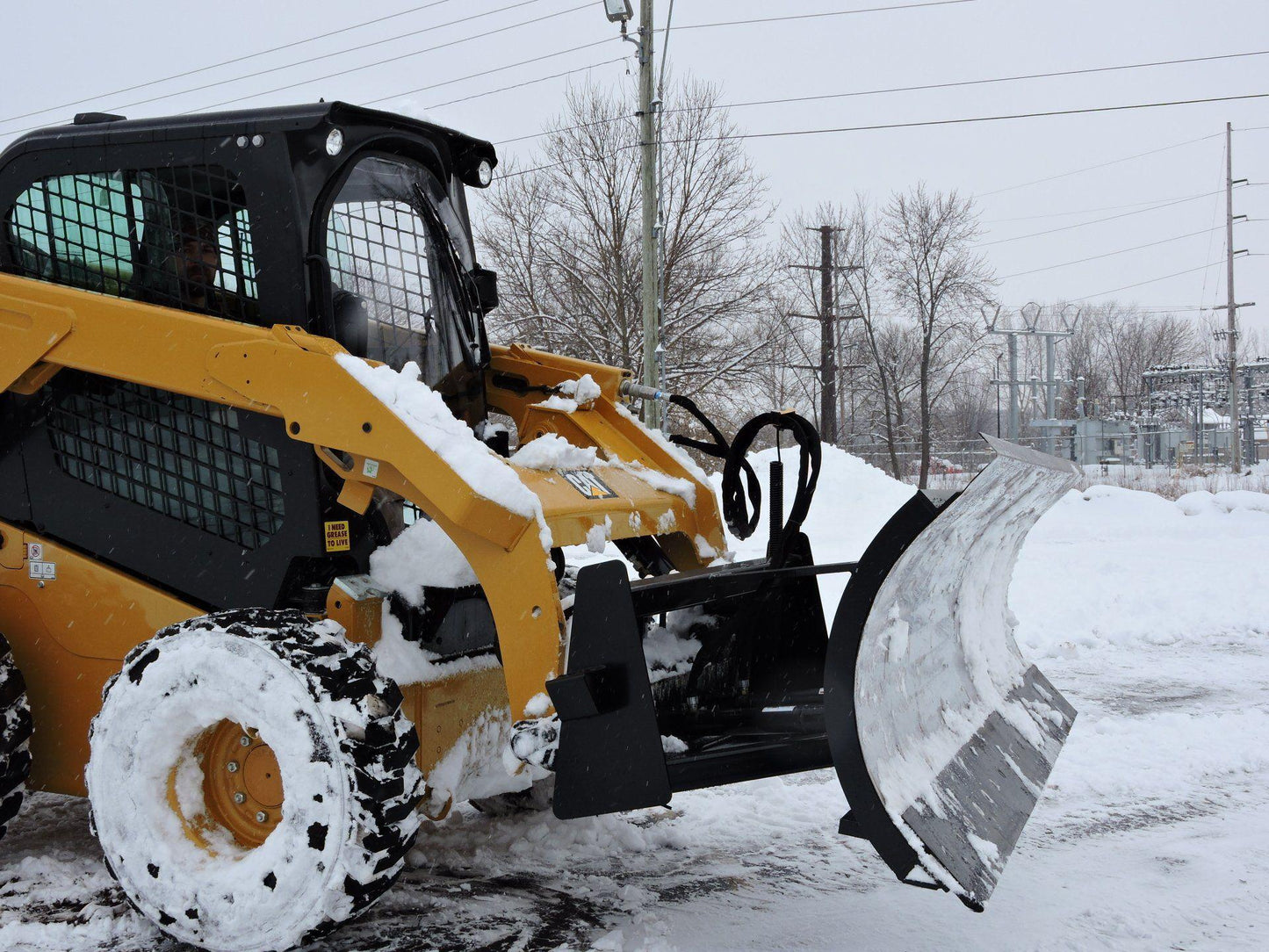 Cat Skid Steer with the Snow Blade Attachment for Skid Steer & Tractor from Berlon Industries Snow Blade Berlon Industries 