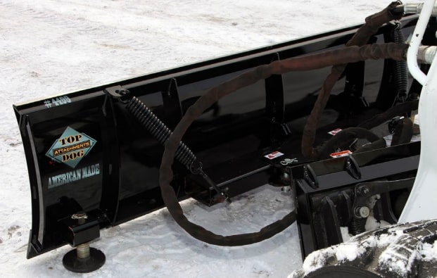 behind the snow blade attachment by top dog