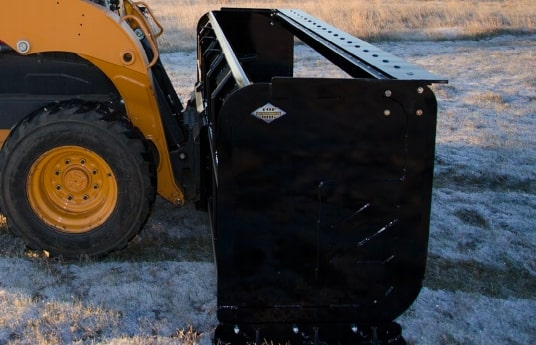 snow pusher in action by top dog attachments