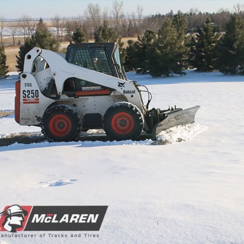 bobcat skid steer in action with the snow plow blade by mclaren industries