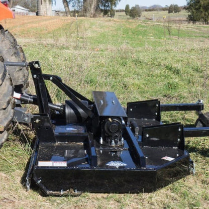 tractor with blue diamond spindle cutter attachment