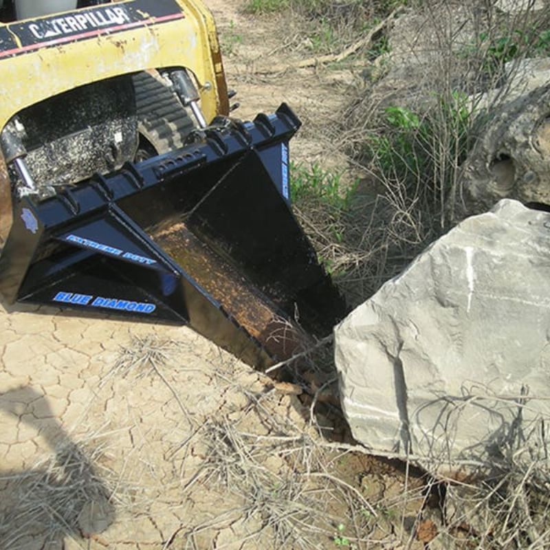 heavy duty stump bucket attachment in action