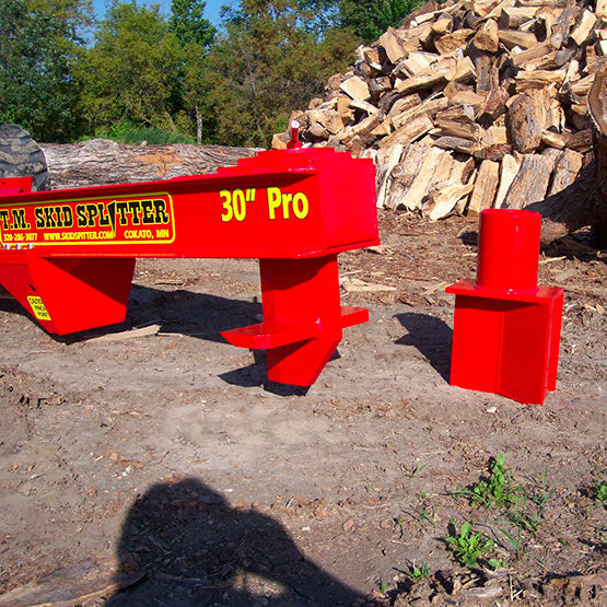 TM Pro 2 Series Skid Splitter with 4 Way Wedge and Single Wedge Next to it