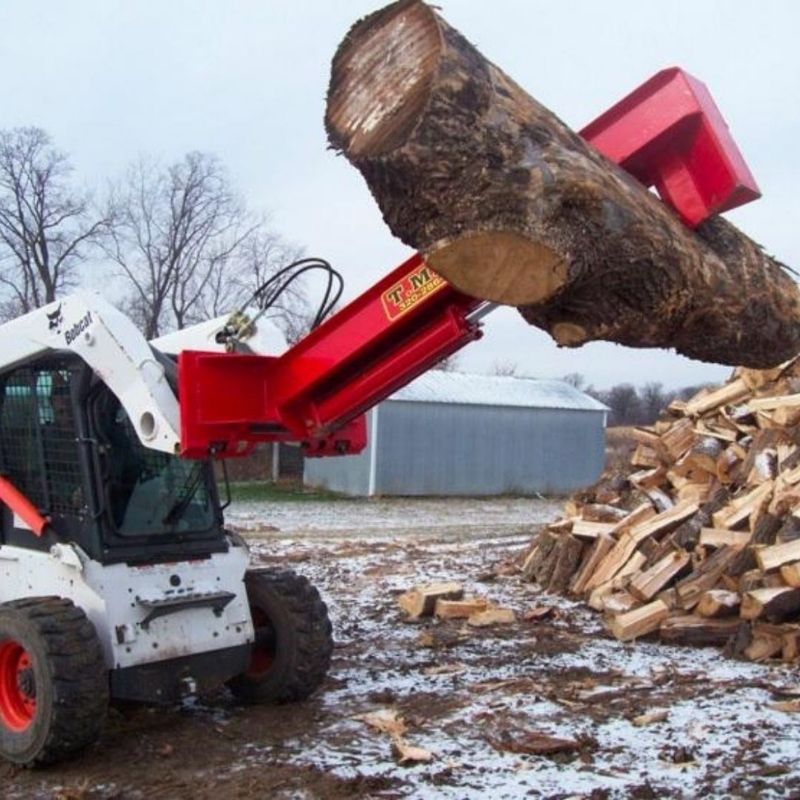 TM Manufacturing Pro Series Log Splitter lifting a large log