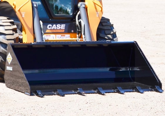 case skid steer with the tough tooth bucket attachment by top dog