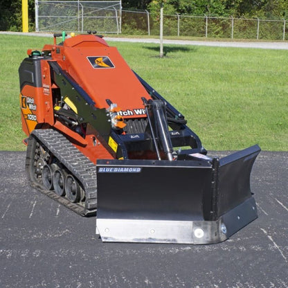 blue diamond v-blade attachment for mini skid steer ready to action in the field